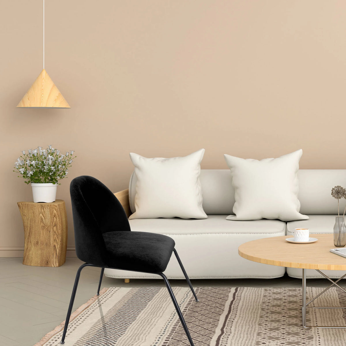 Chaise rembourrée noire VELVO avec des pieds en métal filigranes dans un salon de hjh OFFICE