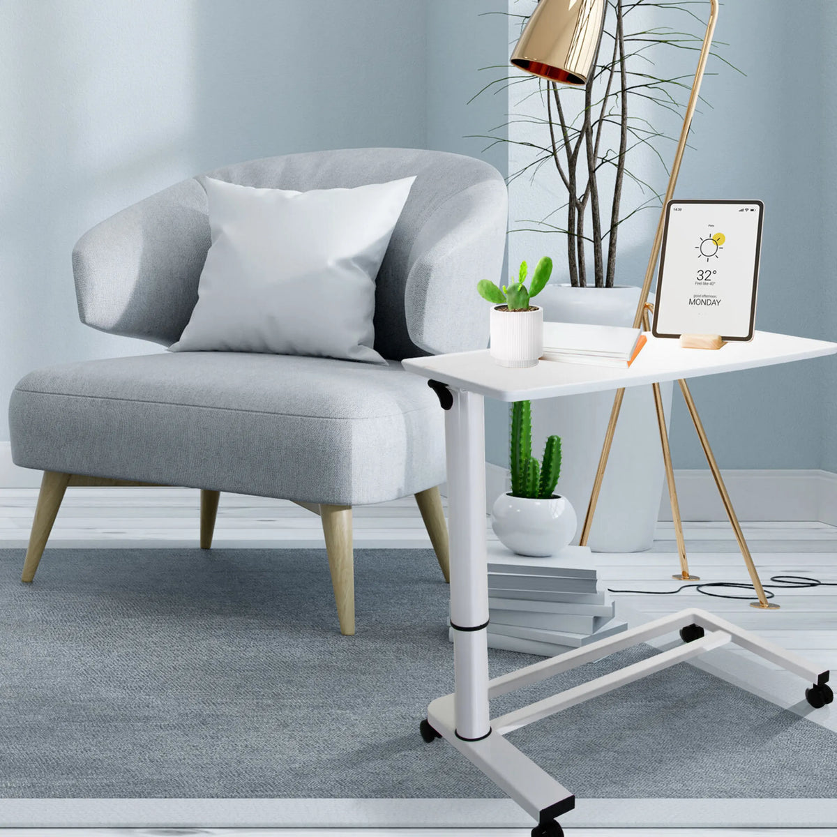 Bureau assis-debout blanc STAND II sur roulettes à côté d'un fauteuil gris de hjh OFFICE