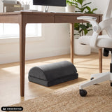 Repose-pieds Podi Velvet 1 noir sous un bureau de hjh OFFICE (image générée par IA)