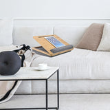 Support pour ordinateur portable COMFILAP III marron avec coussin gris sur un canapé clair de hjh OFFICE
