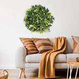 Tapis végétal vert LEAFLUXE WALL 2 en guise de décoration murale circulaire au-dessus d'un canapé de hjh LIVING
