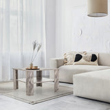 Table basse BISMO grise effet marbre, deux niveaux et forme carrée dans un salon de hjh LIVING