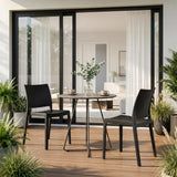 Chaises d'extérieur T37 V 4 en noir autour d'une table de jardin ronde sur une terrasse de hjh LIVING