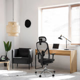 Siège de bureau de qualité professionnelle RALOO PRO en noir avec dossier en maille et appuie-tête à un bureau de hjh OFFICE