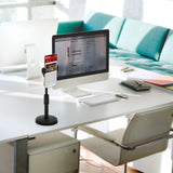 Support de téléphone portable & tablette FLEXMOBI II noir sur un bureau blanc à côté d'un écran de hjh OFFICE