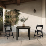 Deux chaises d'extérieur TRAVANO 1 noires avec table assortie sur une terrasse de hjh LIVING