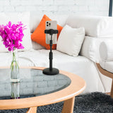 Support de téléphone portable & tablette FLEXMOBI II noir avec smartphone sur une table en verre devant un canapé blanc de hjh OFFICE