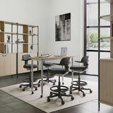 Quatre chaises de travail TOP WORK 40 gris foncé avec accoudoirs et repose-pieds à un bureau blanc de hjh OFFICE